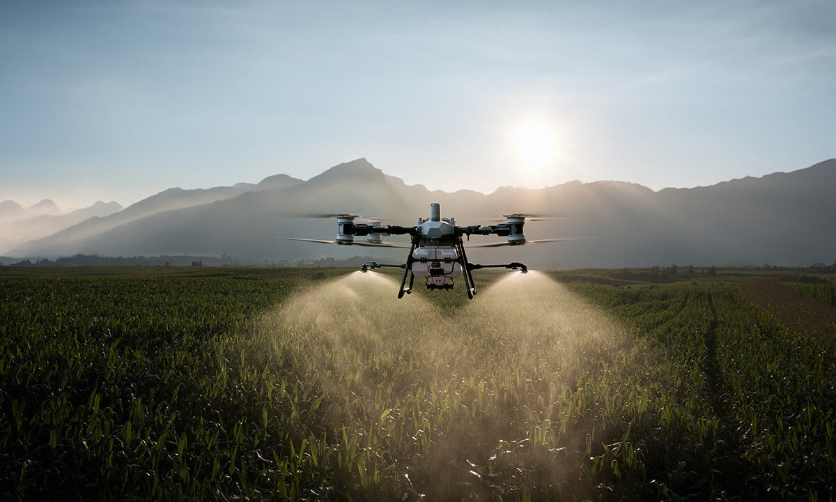TJ Aerosense agricultural spray drone operating over a field